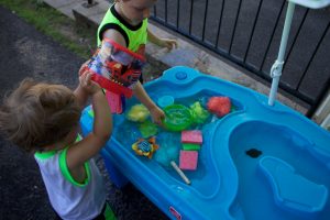 6 cheap and easy ideas for DIY water table activities. My kids are a toddler and a preschooler and they love these creative outdoor homemade outdoor play activities. They are a lot of fun for kids and can be made from repurposed objects. The water table toys can easily be adapted for sand and other sensory play.