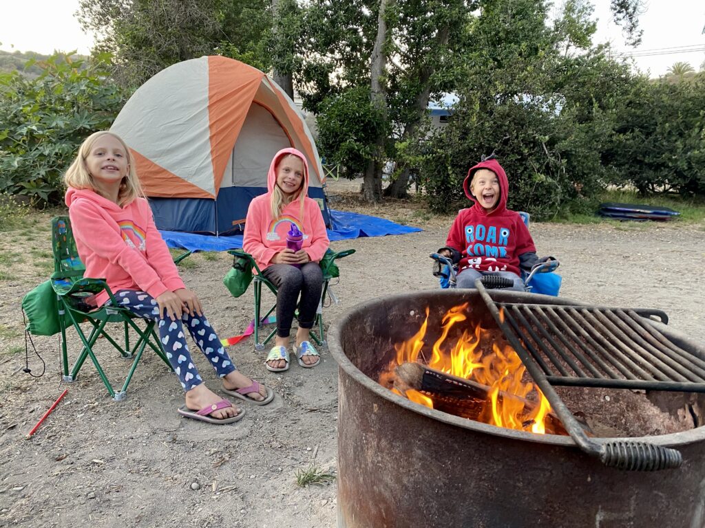 around the fire pit while camping at Refugio State Park